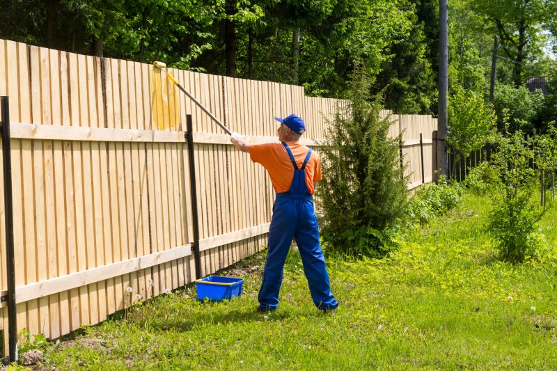 Exterior painting of a backyard fence